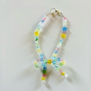 Dainty wrist candy! Hand-crafted, beaded bow bracelet with multi-color beads!